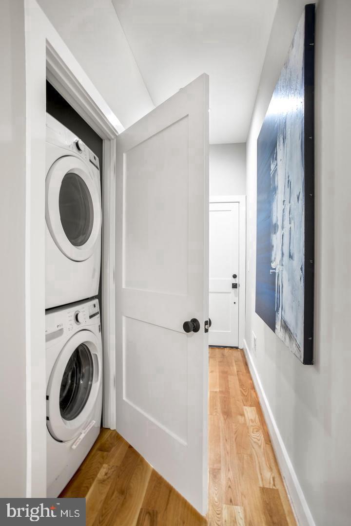 1420 Staples Street Northeast, Unit 2 Washington, DC 20002 - Photo 9 of 17 a view of a hallway with washer and dryer