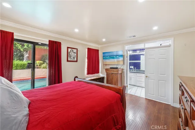 a bed room with a bed and a television