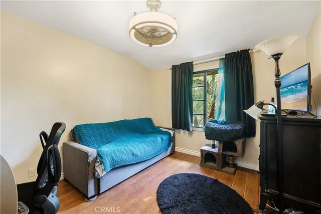 a view of a livingroom with workspace and a window