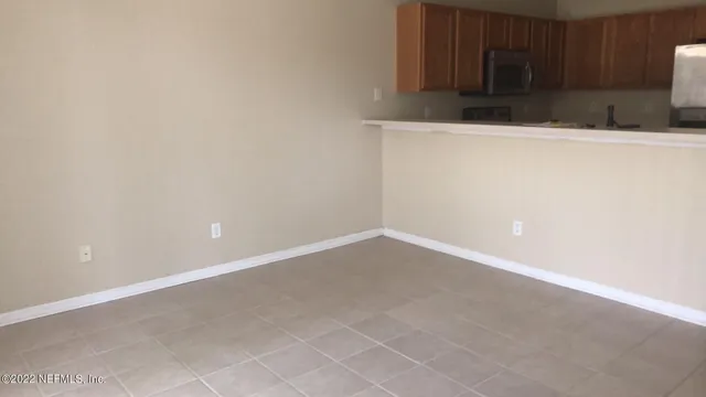 a view of cabinets and wooden floor