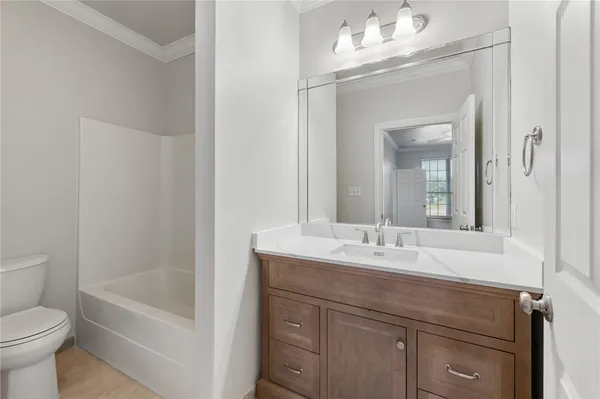 a bathroom with a sink a toilet and a bathtub