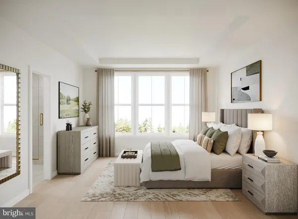 a bedroom with furniture and a large window