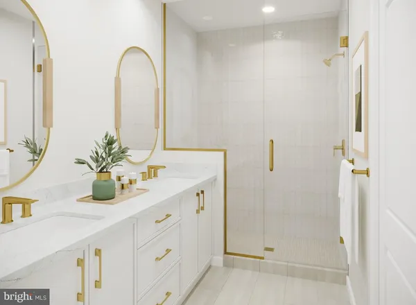 a bathroom with a double vanity sink and shower