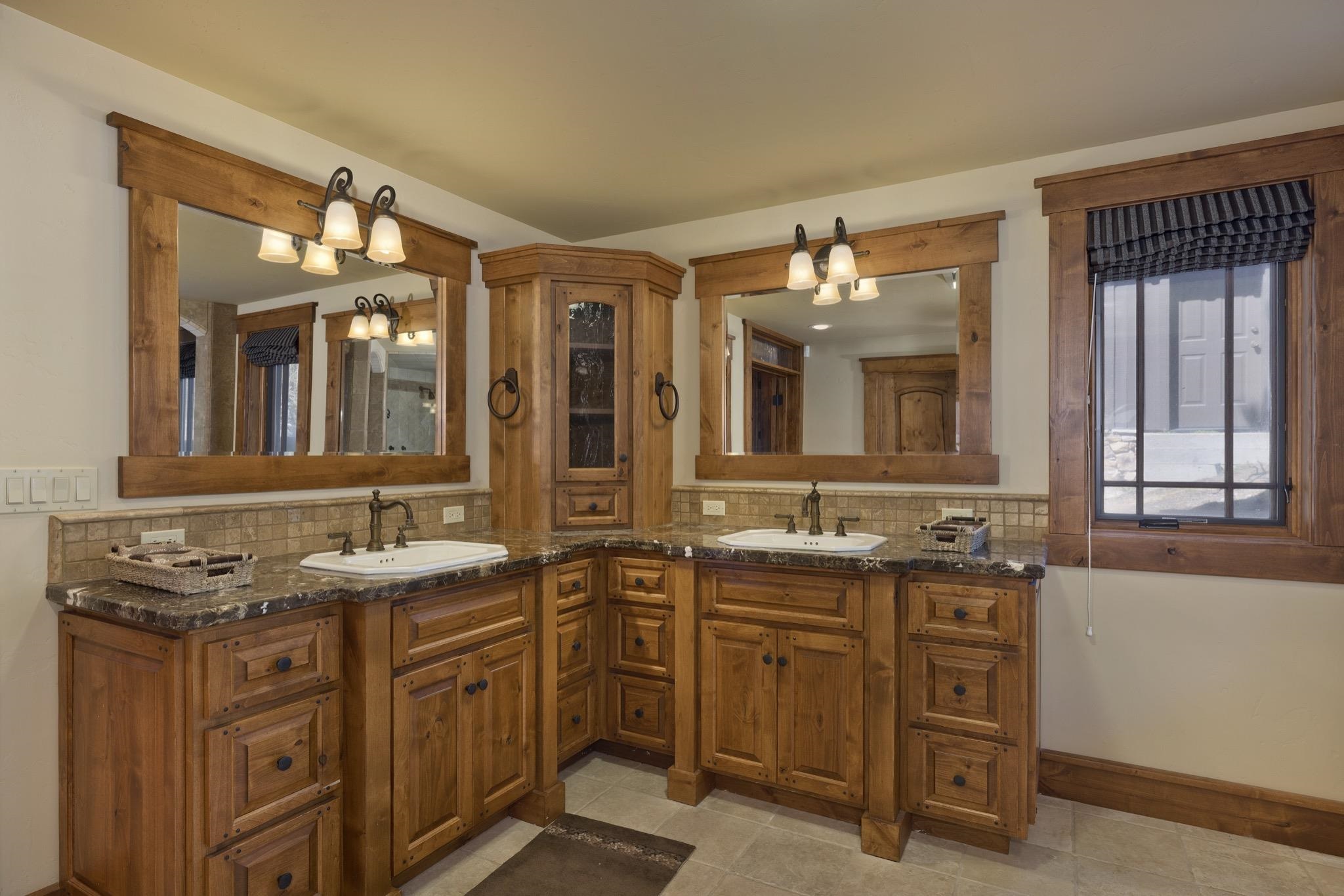 269 Juniper Road Mammoth Lakes, CA 93546 - Photo 24 of 56 a bathroom with a granite countertop sink and a mirror