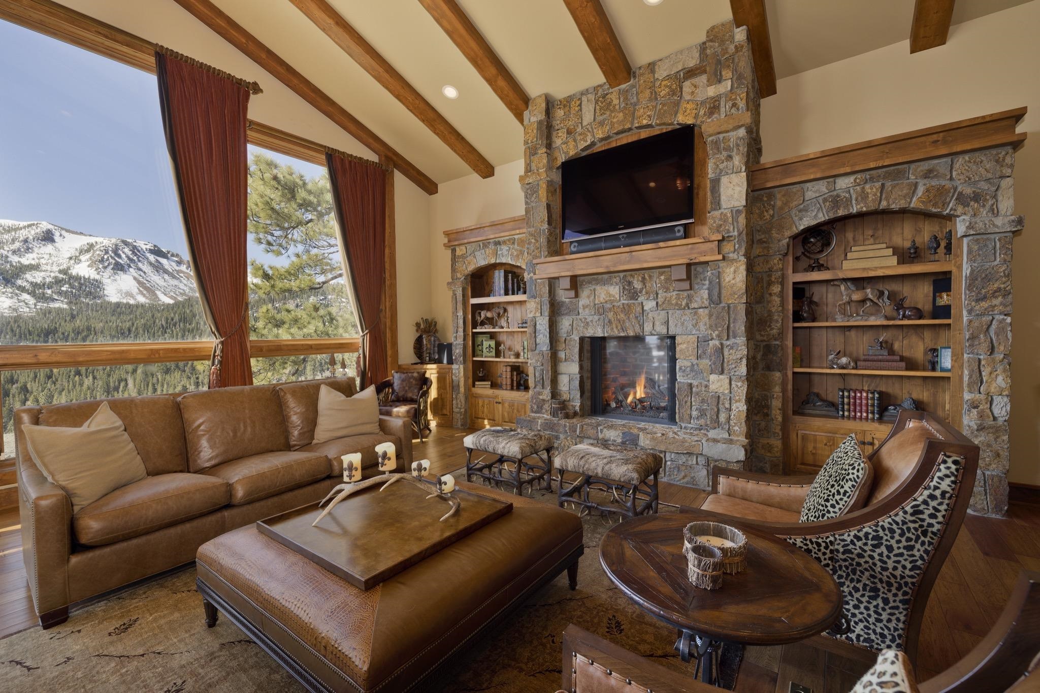 269 Juniper Road Mammoth Lakes, CA 93546 - Photo 8 of 56 a living room with furniture a fireplace and a flat screen tv
