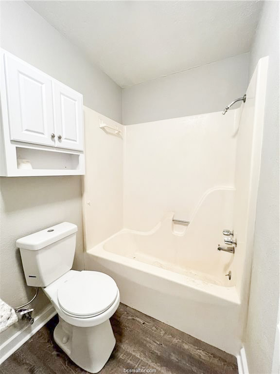 3802 College Main Street, Unit 6 Bryan, TX 77801 - Photo 7 of 12 a bathroom with a toilet and a bathtub