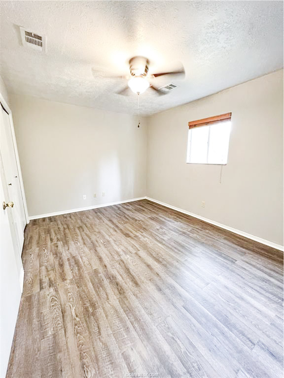3802 College Main Street, Unit 6 Bryan, TX 77801 - Photo 10 of 12 a view of empty room with wooden floor