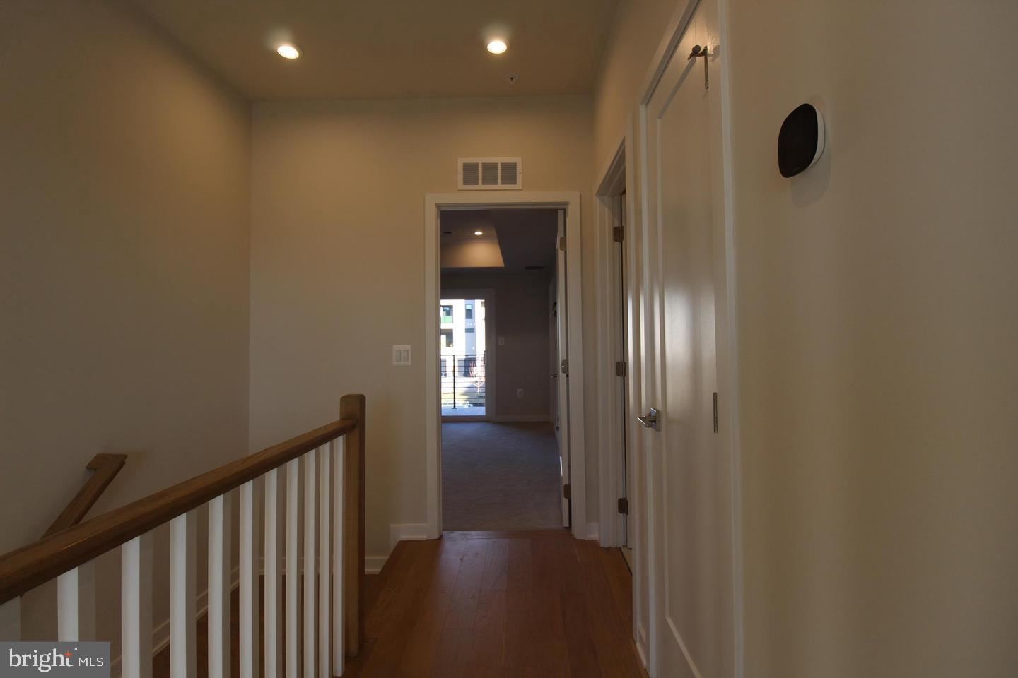 22383 Roanoke Rise Terrace Ashburn, VA 20148 - Photo 18 of 41 a view of a hallway with wooden floor