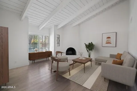 a living room with furniture and a potted plant