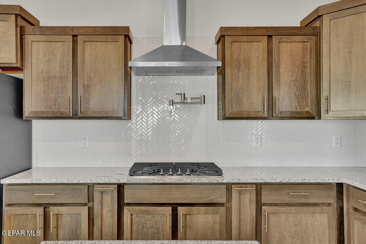 6924 Levee Circle Anthony, NM 88021 - Photo 11 of 36 a kitchen with a sink a stove and cabinets