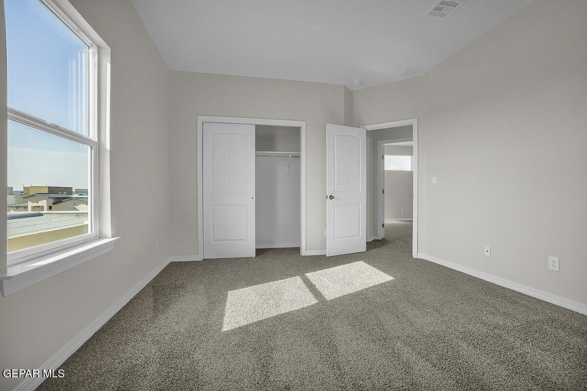 6924 Levee Circle Anthony, NM 88021 - Photo 26 of 36 an empty room with windows