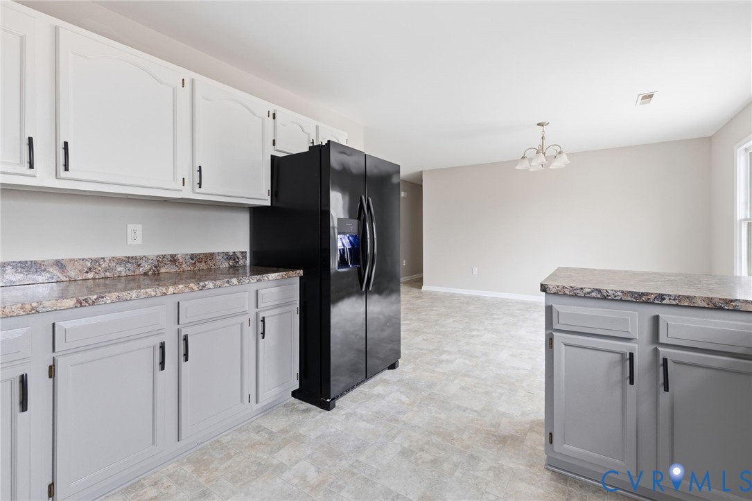 836 Walkerton Road Walkerton, VA 23177 - Photo 13 of 29 a kitchen with stainless steel appliances granite countertop a refrigerator and a stove top oven