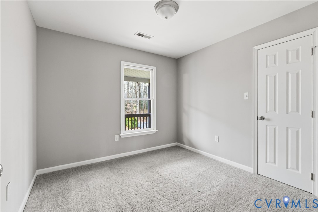 836 Walkerton Road Walkerton, VA 23177 - Photo 15 of 29 an empty room with windows