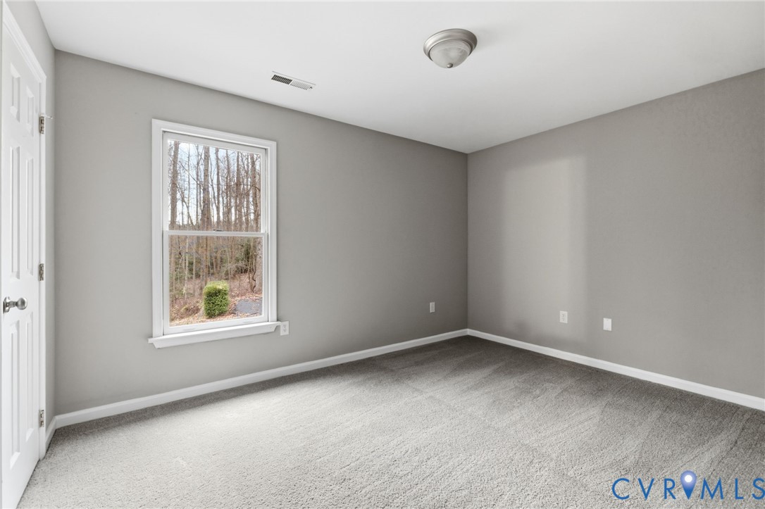 836 Walkerton Road Walkerton, VA 23177 - Photo 17 of 29 an empty room with windows