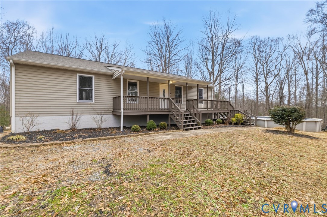 836 Walkerton Road Walkerton, VA 23177 - Photo 2 of 29 a front view of a house with a yard covered in snow