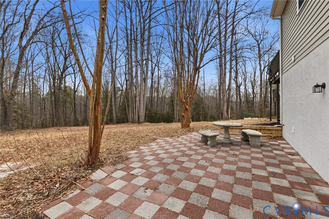836 Walkerton Road Walkerton, VA 23177 - Photo 25 of 29 a backyard of a house with lots of green space