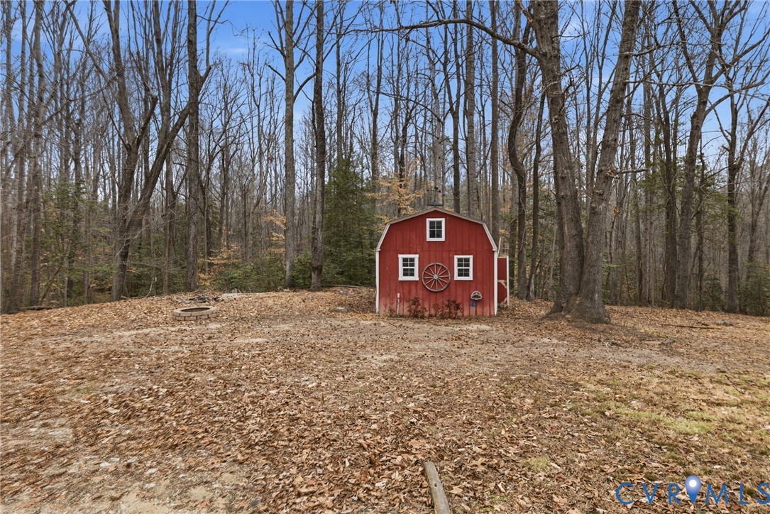 836 Walkerton Road Walkerton, VA 23177 - Photo 26 of 29 a wooden fence with some trees in the background