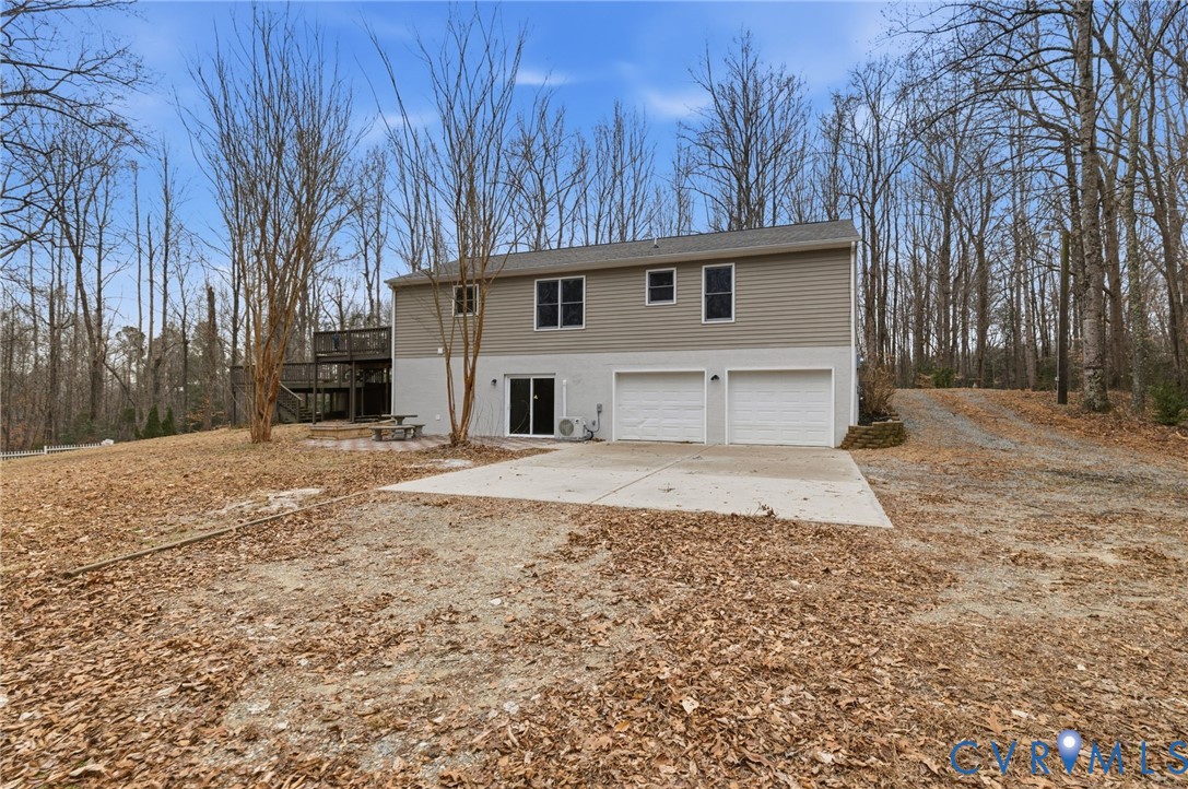 836 Walkerton Road Walkerton, VA 23177 - Photo 27 of 29 a house with trees in front of it
