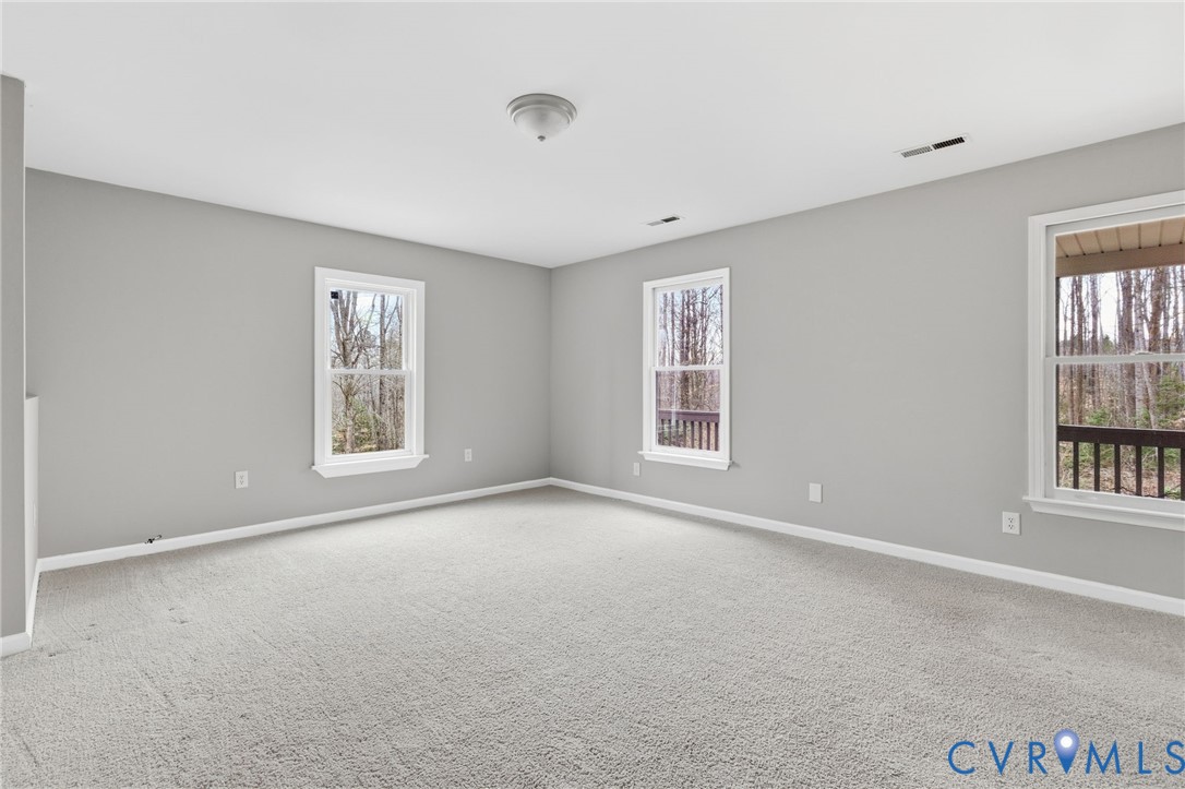 836 Walkerton Road Walkerton, VA 23177 - Photo 5 of 29 an empty room with windows and closet