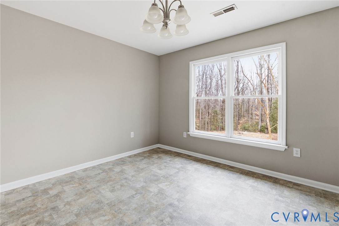 836 Walkerton Road Walkerton, VA 23177 - Photo 8 of 29 an empty room with a window