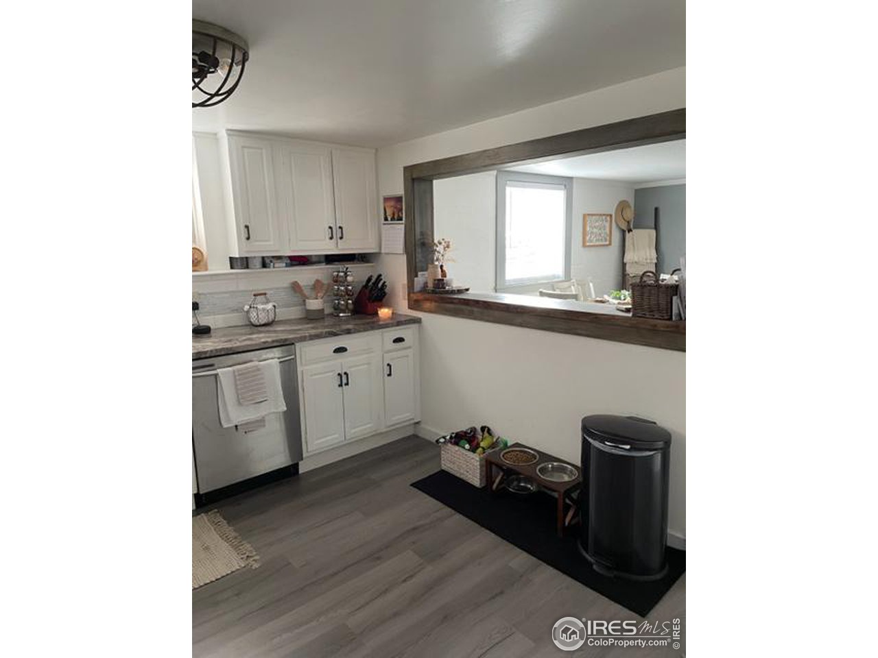 125 West Trilby Road Fort Collins, CO 80525 - Photo 18 of 26 a kitchen with a sink and cabinets