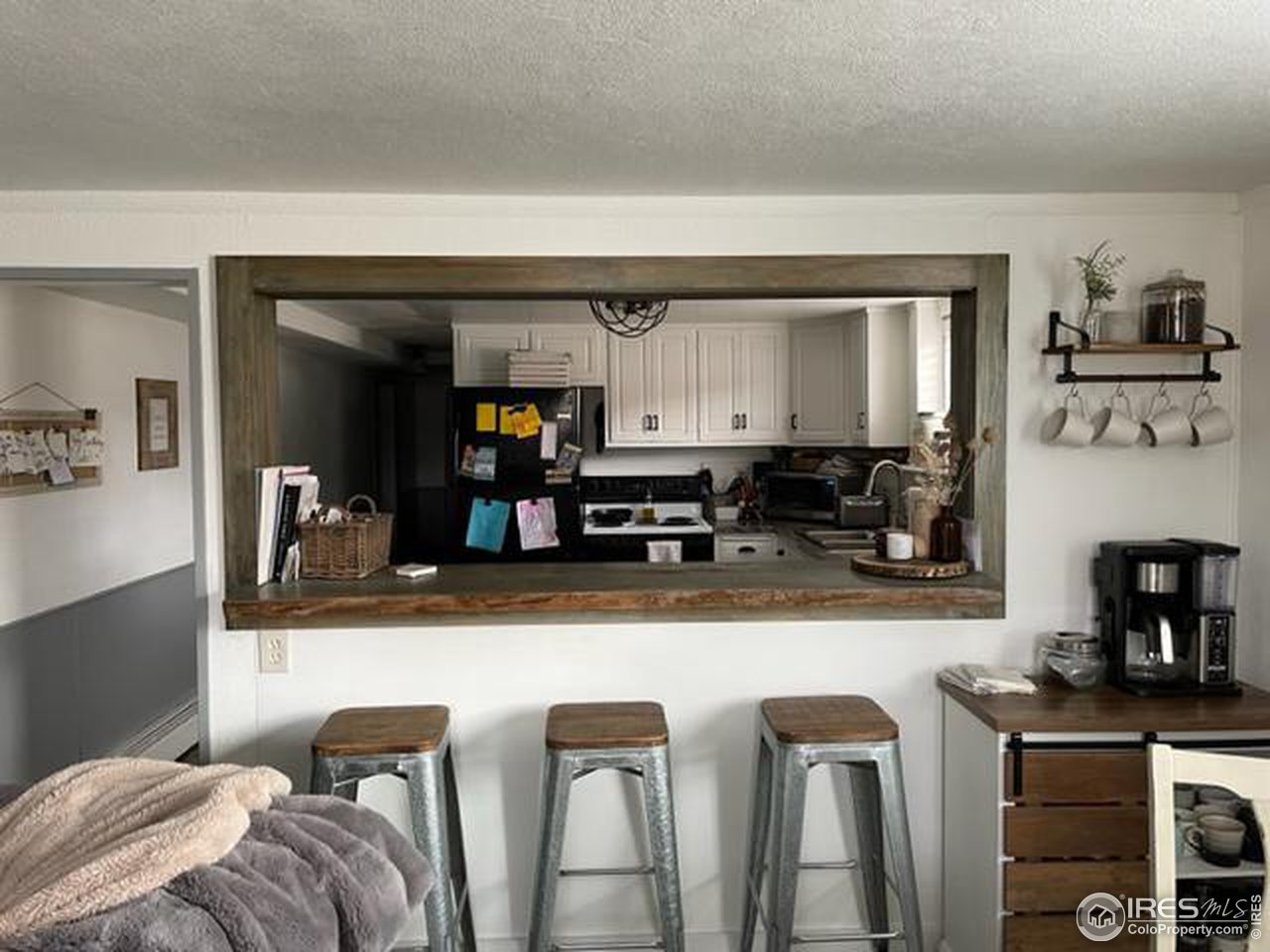 125 West Trilby Road Fort Collins, CO 80525 - Photo 19 of 26 a kitchen with stainless steel appliances granite countertop a sink and a refrigerator