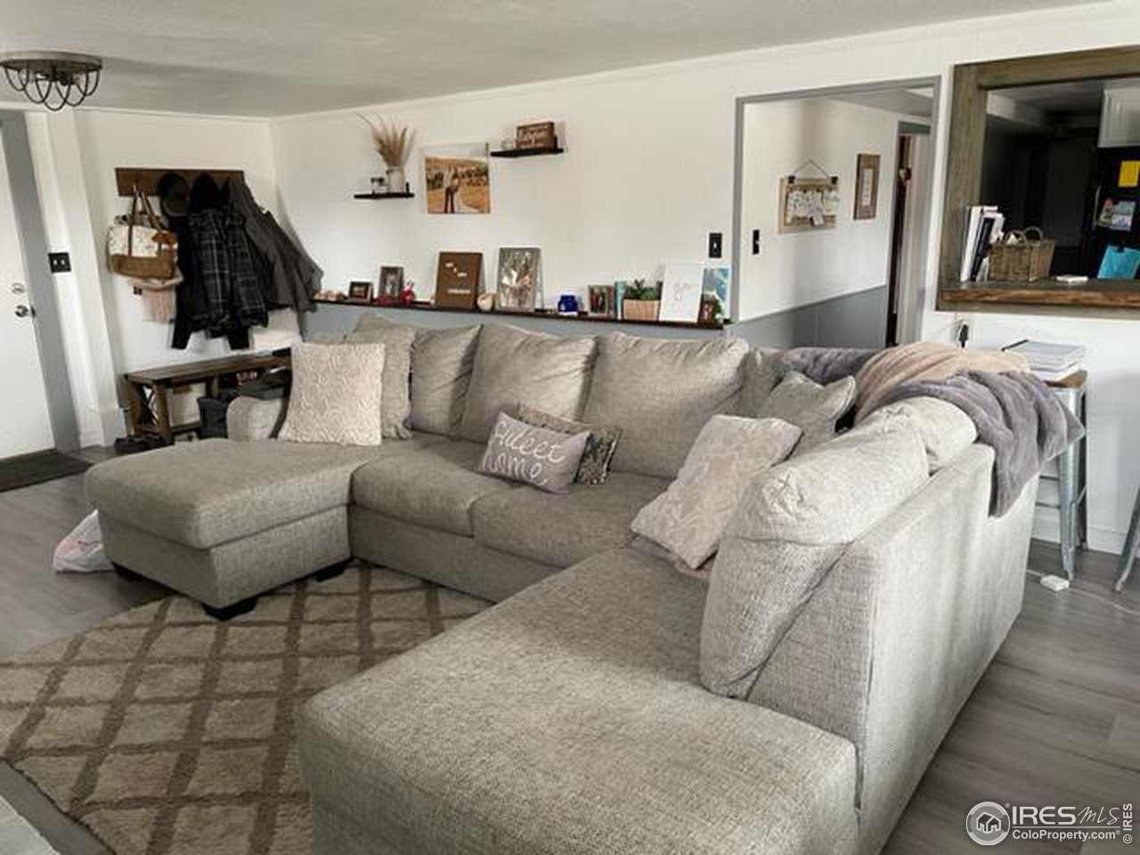 125 West Trilby Road Fort Collins, CO 80525 - Photo 21 of 26 a living room with furniture and a wooden floor