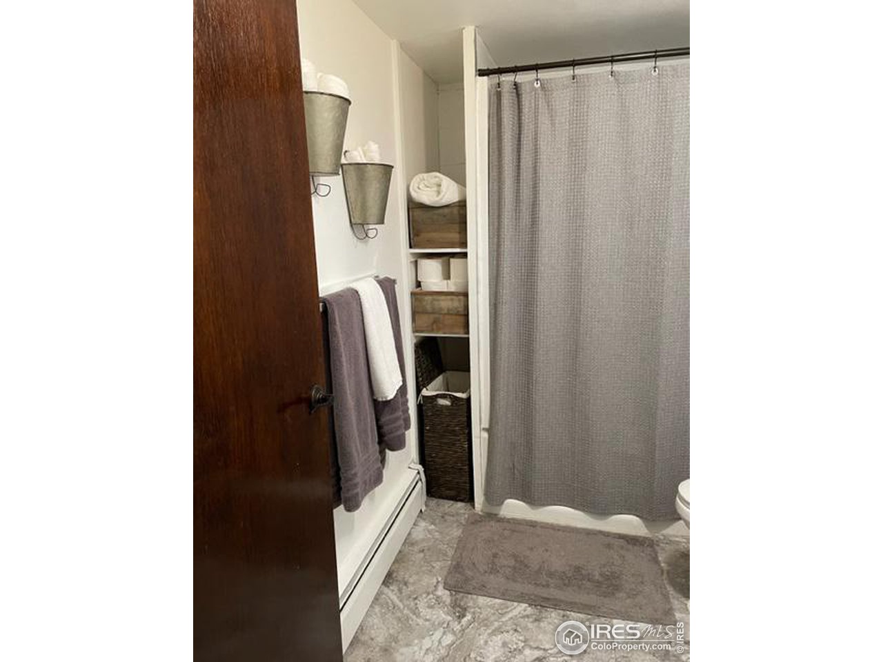 125 West Trilby Road Fort Collins, CO 80525 - Photo 25 of 26 a view of a refrigerator in kitchen and utility room
