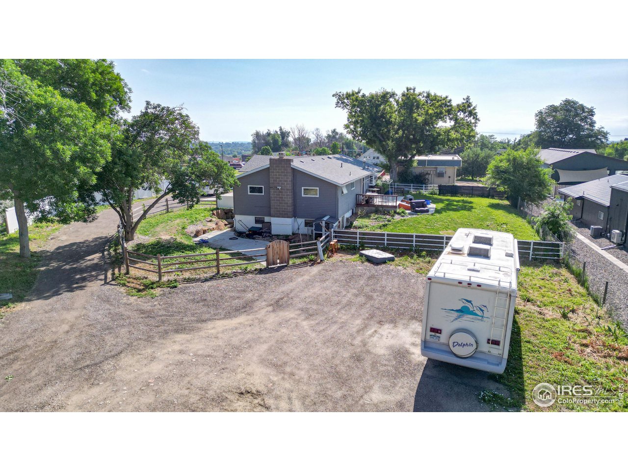 125 West Trilby Road Fort Collins, CO 80525 - Photo 4 of 26 a aerial view of a house with a garden and parking space