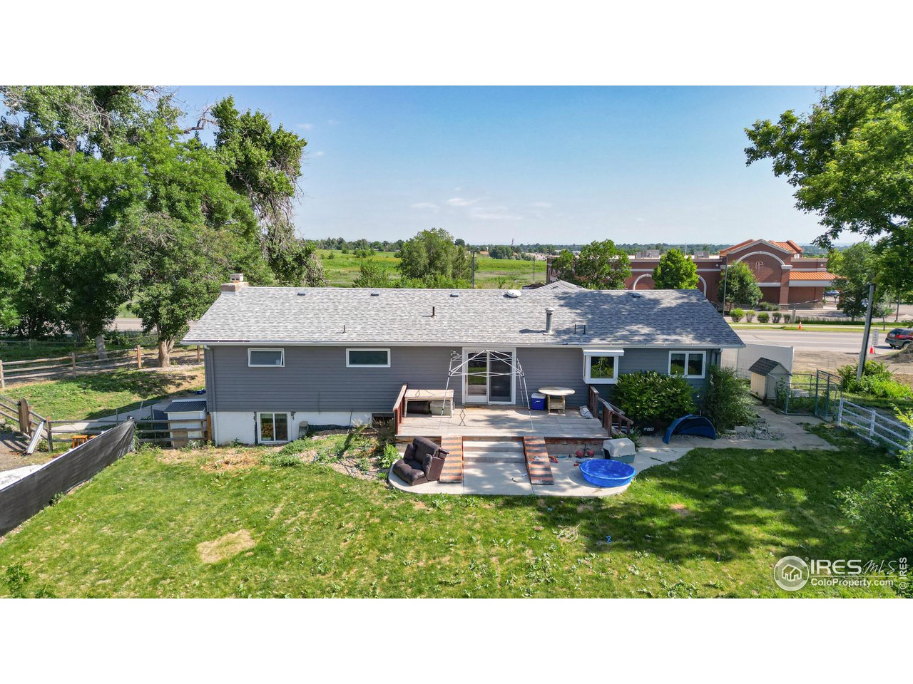 125 West Trilby Road Fort Collins, CO 80525 - Photo 5 of 26 a aerial view of a house with table and chairs