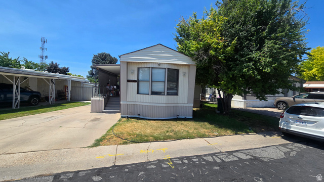 1500 Angel Street North, Unit 53 Layton, UT 84041 - Photo 2 of 20 Single-story residence featuring light-colored siding and a covered front porch