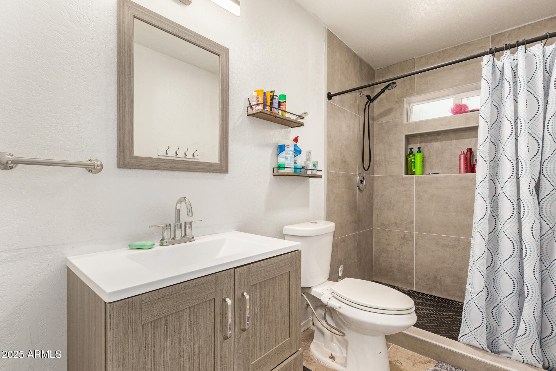 1980 South Apache Drive Apache Junction, AZ 85120 - Photo 13 of 19 a bathroom with a sink toilet and shower
