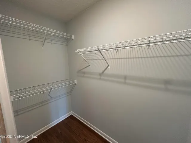 a view of balcony with wooden floor