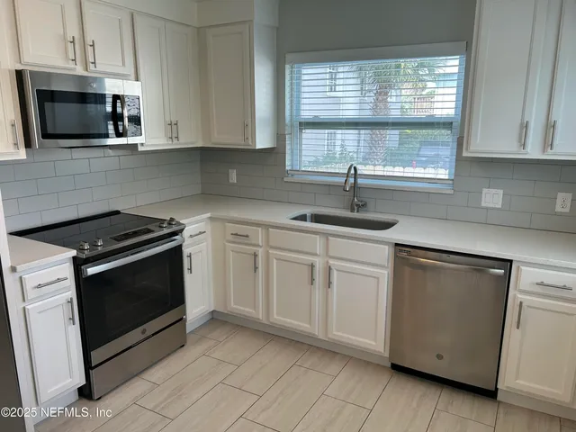 a bathroom with a glass door shower