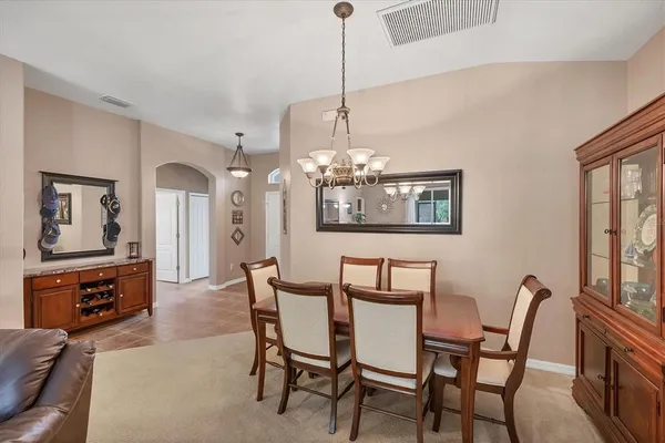 a kitchen with stainless steel appliances granite countertop a sink a stove a microwave a refrigerator and cabinets