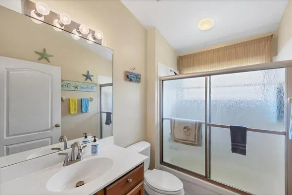 a living room with a floor to ceiling window and floor to ceiling window