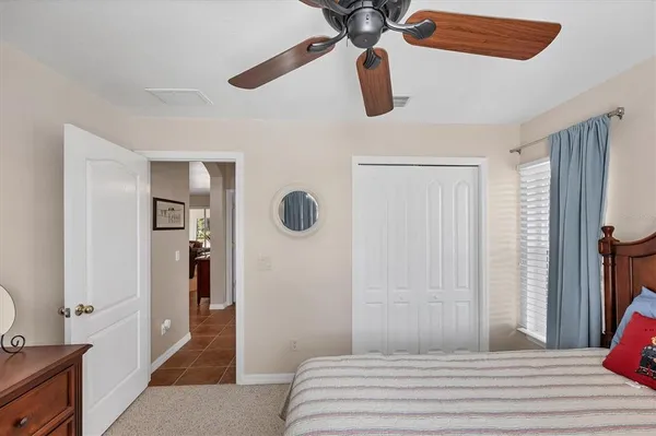 a living room with furniture and a glass door