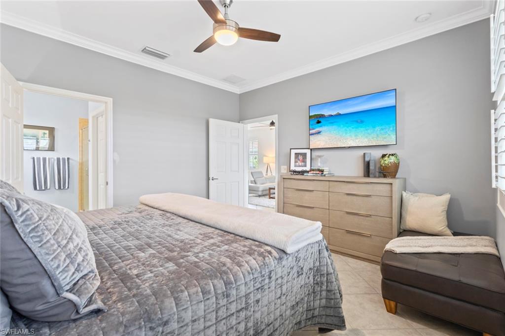 5719 Declaration Court Ave Maria, FL 34142 - Photo 14 of 48 a bedroom with a bed and a couch