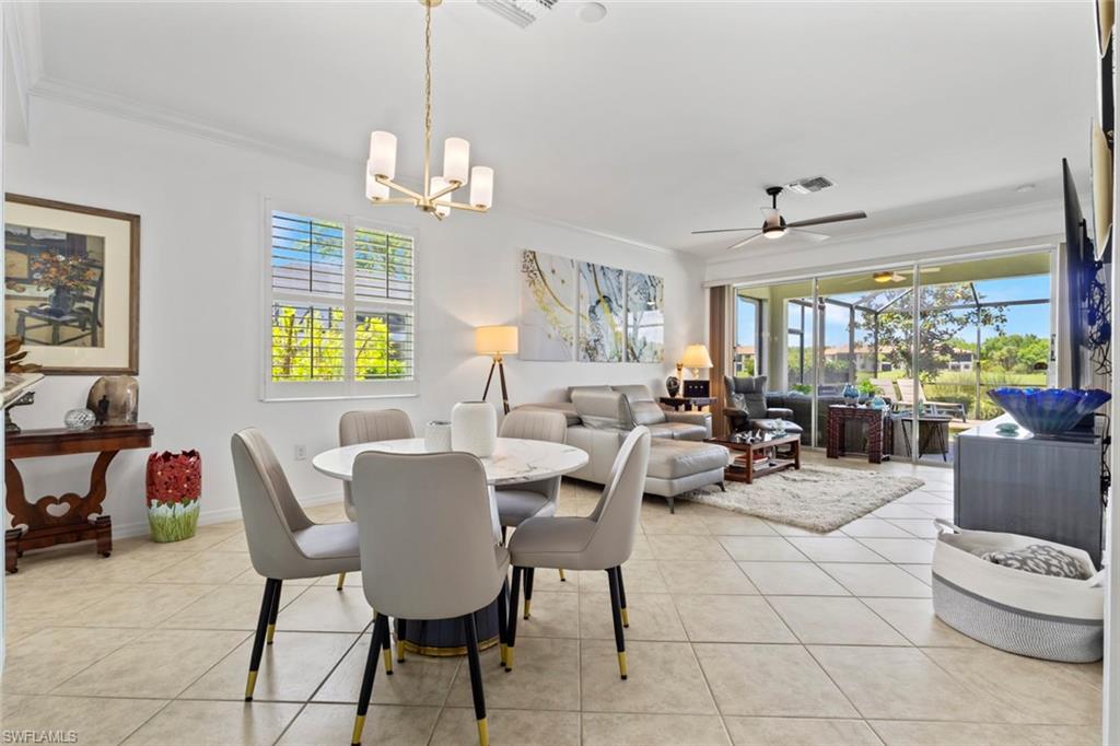 5719 Declaration Court Ave Maria, FL 34142 - Photo 17 of 48 a view of a livingroom and a dining room with furniture window and outside view
