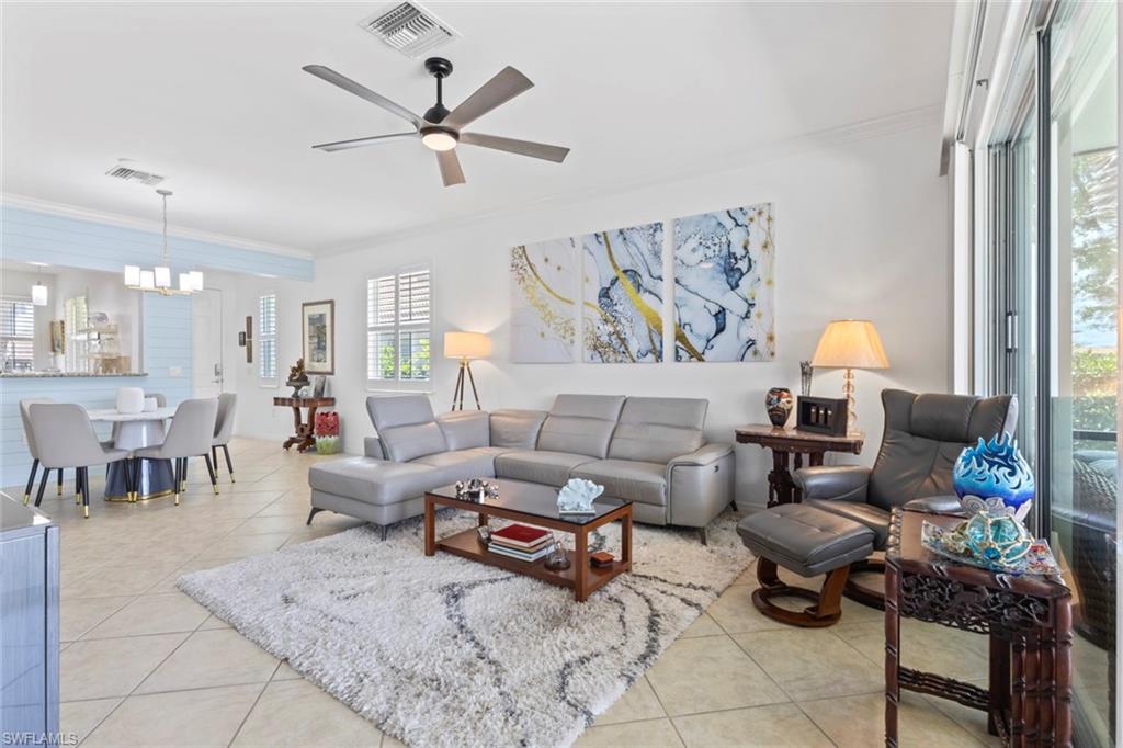 5719 Declaration Court Ave Maria, FL 34142 - Photo 18 of 48 a living room with furniture and a chandelier