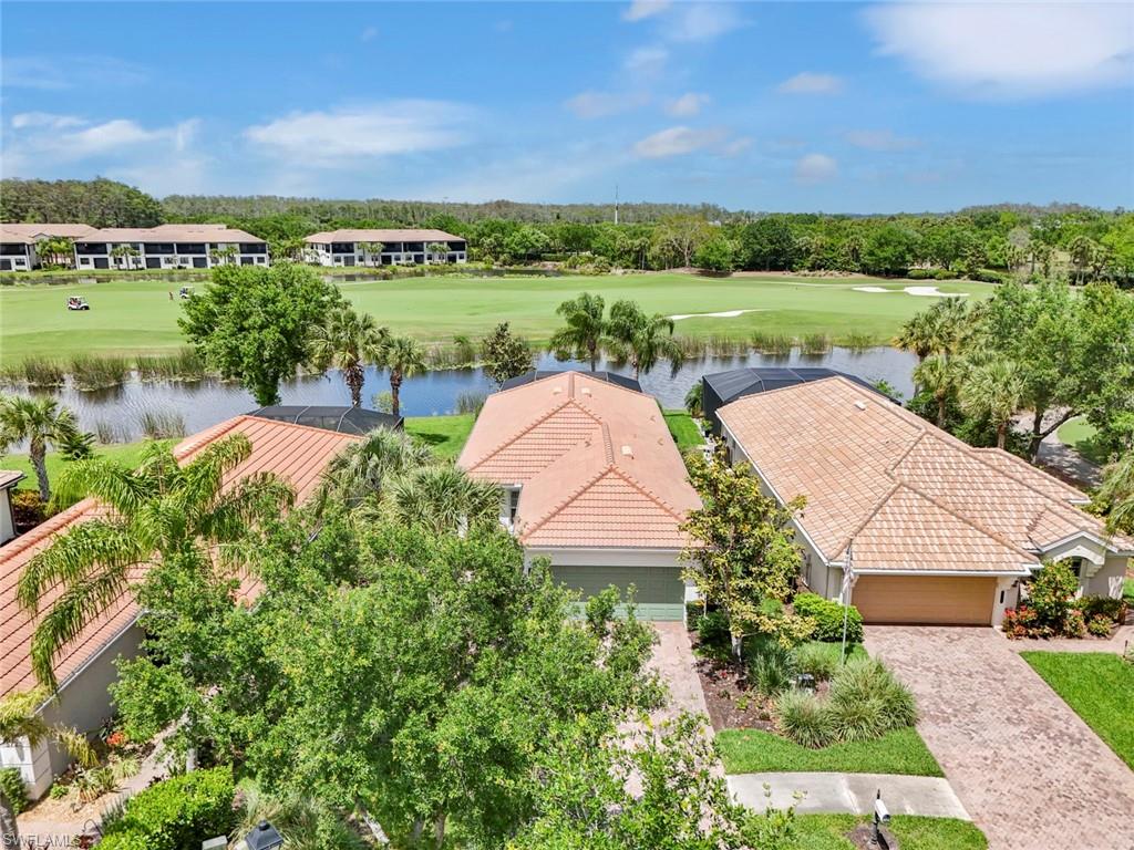 5719 Declaration Court Ave Maria, FL 34142 - Photo 2 of 48 an aerial view of a house with yard and lake view