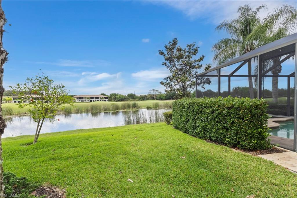 5719 Declaration Court Ave Maria, FL 34142 - Photo 32 of 48 a view of a garden with a lake