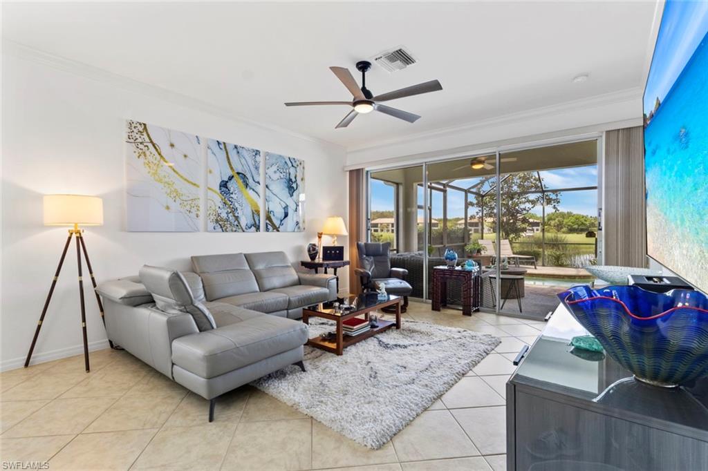 5719 Declaration Court Ave Maria, FL 34142 - Photo 4 of 48 a living room with furniture and a large window