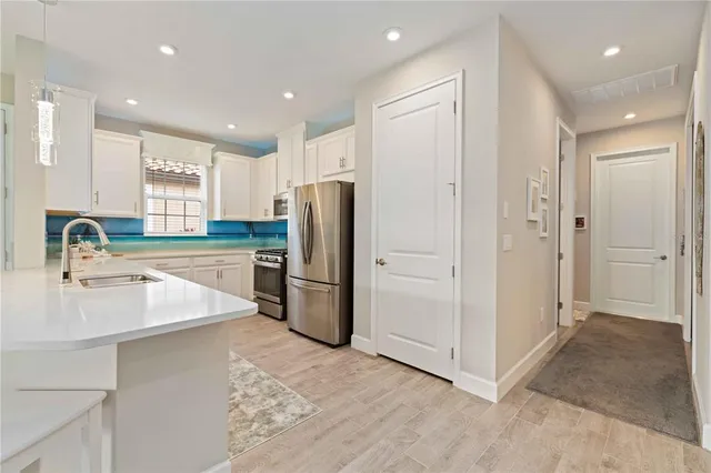 an aerial view of residential houses with yard and swimming pool