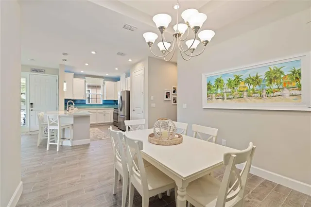 a sign that is sitting in the grass next to a road