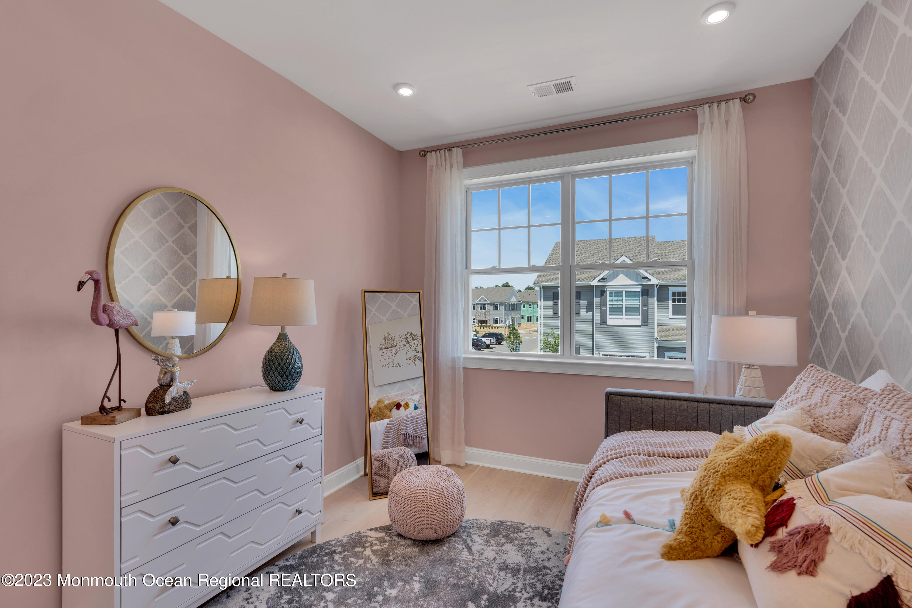 22 Chapel Lane Neptune, NJ 07753 - Photo 14 of 30 a bedroom with a bed and large windows