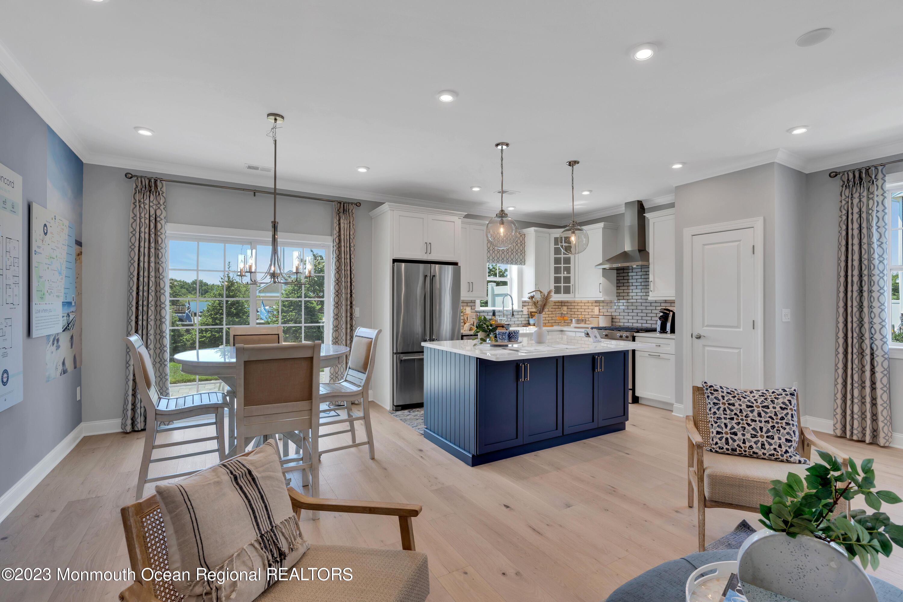 22 Chapel Lane Neptune, NJ 07753 - Photo 2 of 30 a kitchen with a refrigerator dining table and chairs