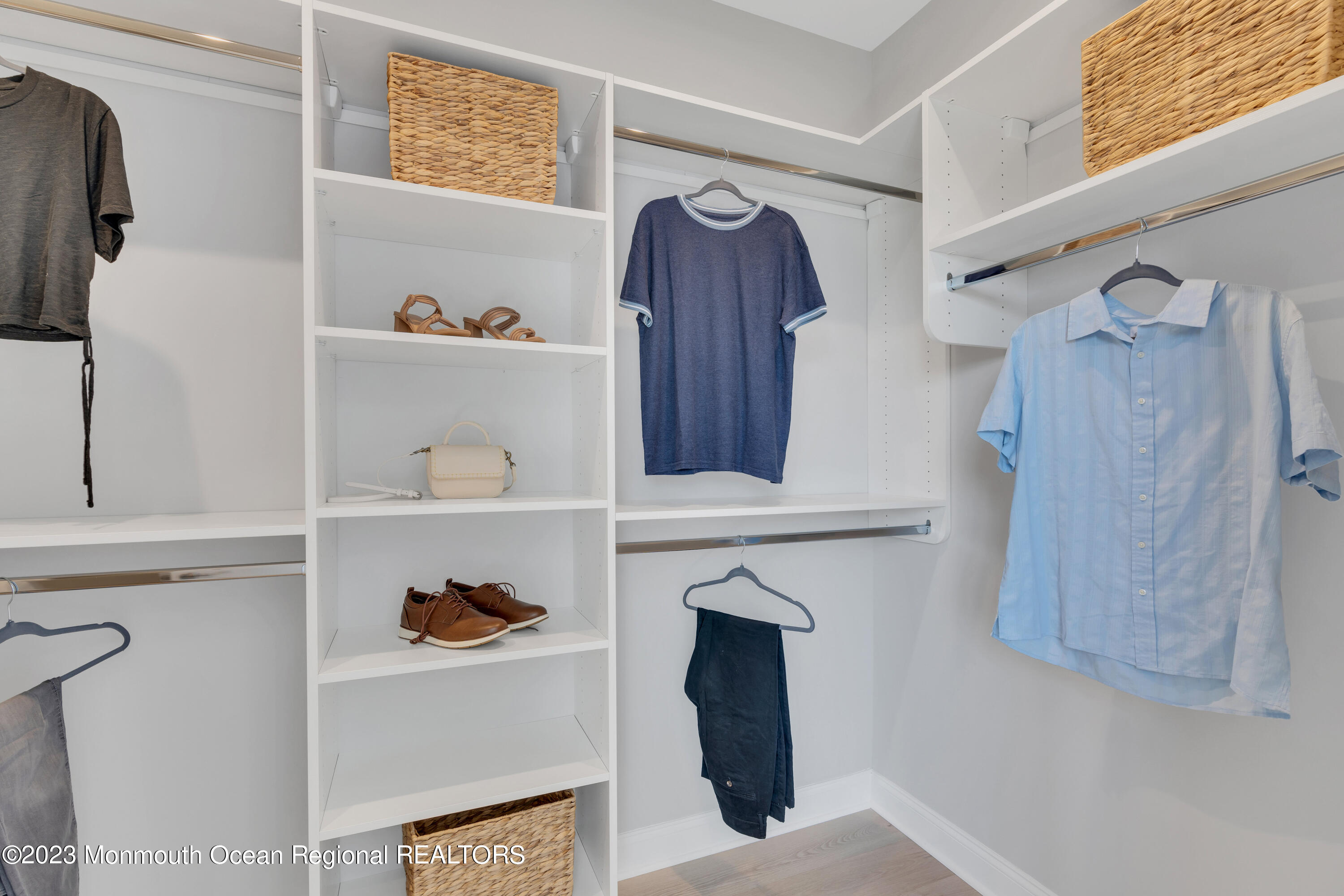 22 Chapel Lane Neptune, NJ 07753 - Photo 22 of 30 a view of walk in closet with clothes and shoes