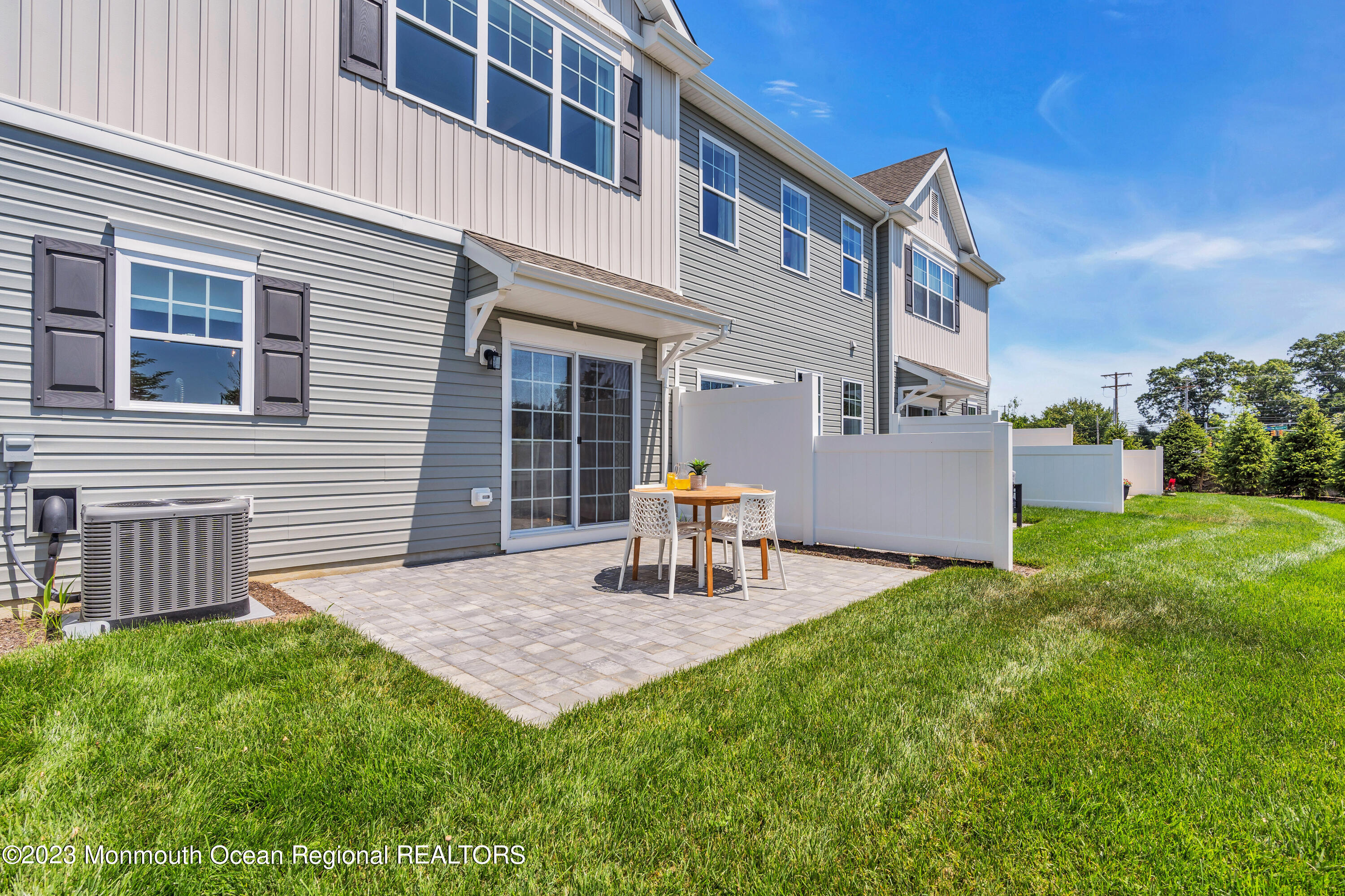 22 Chapel Lane Neptune, NJ 07753 - Photo 28 of 30 a view of a house with backyard and a chair