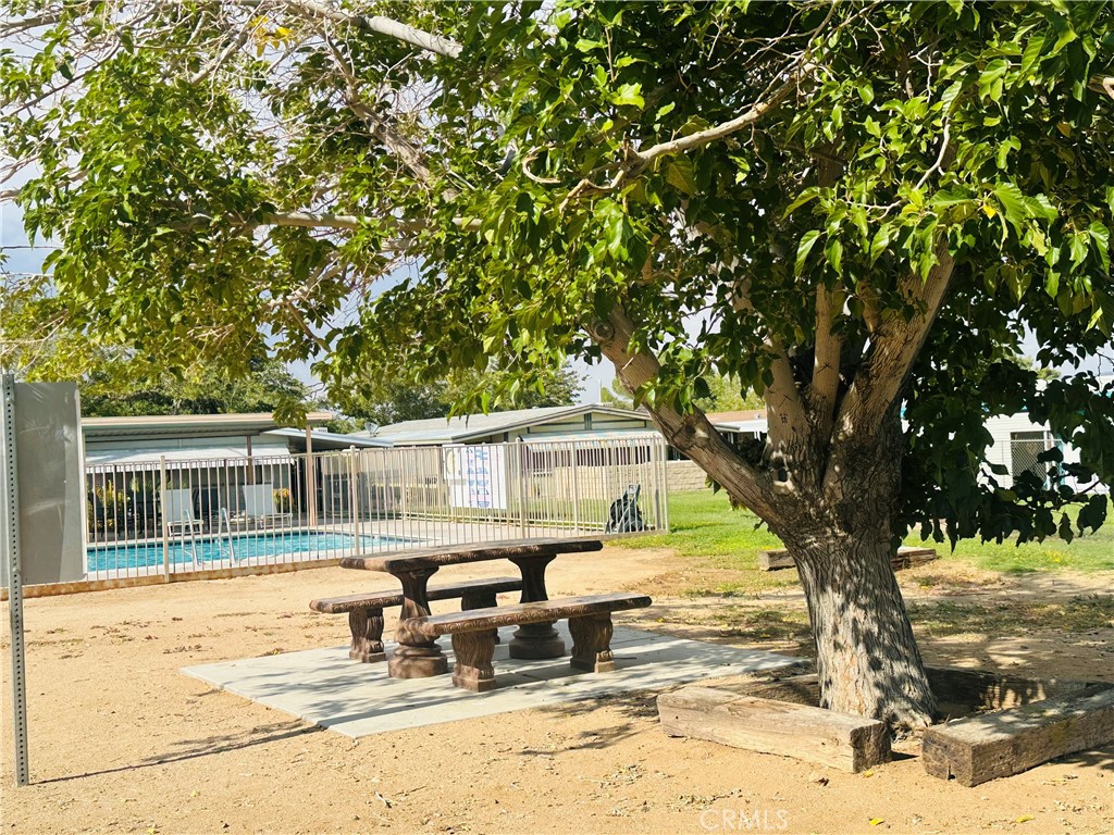20683 Waalew Road, Unit B145 Apple Valley, CA 92307 - Photo 21 of 32 a view of a house with a patio